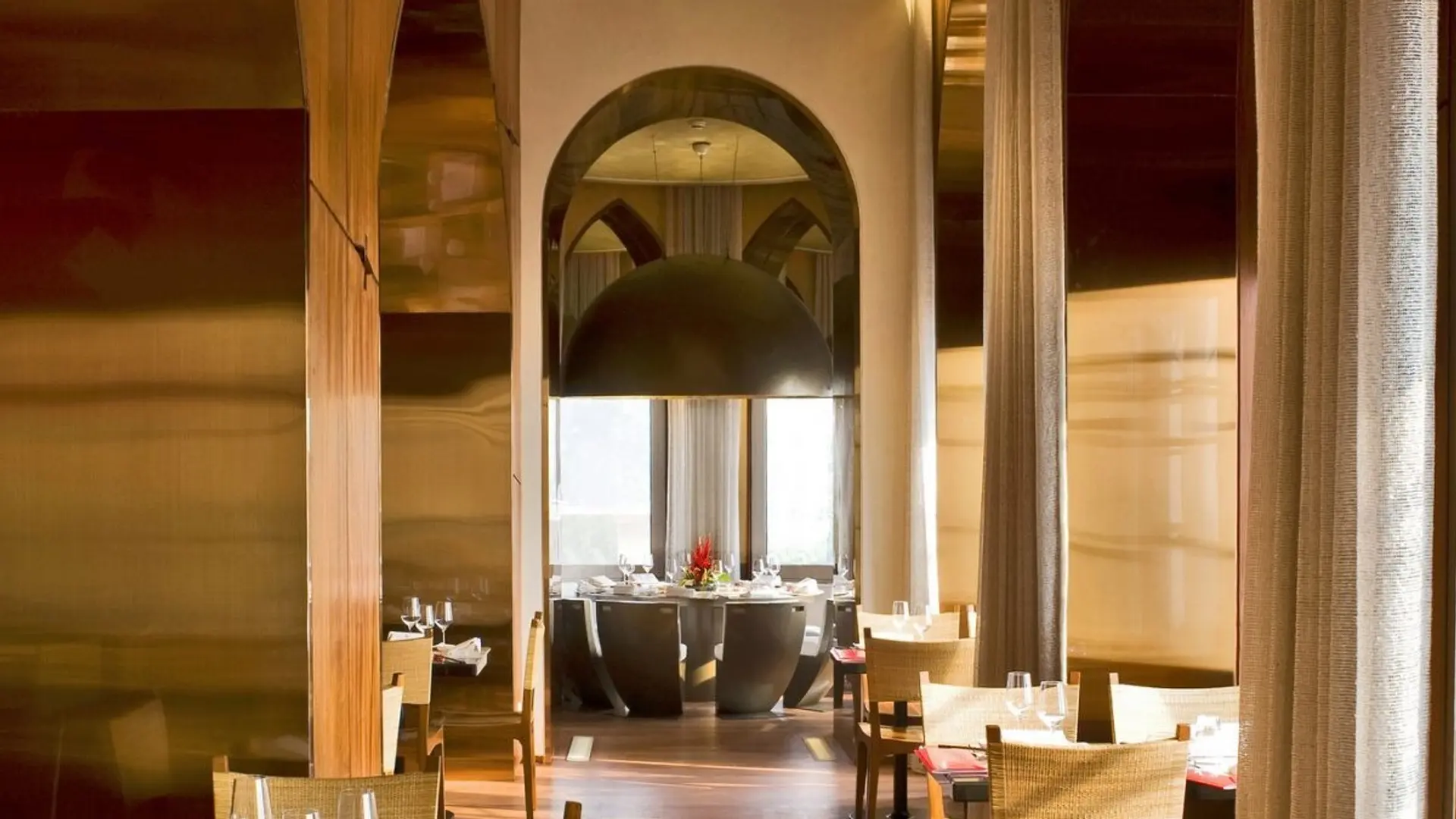 Dining area with large round black sining table, other smaller tables at The Traditional japenese courses at Wasabi 