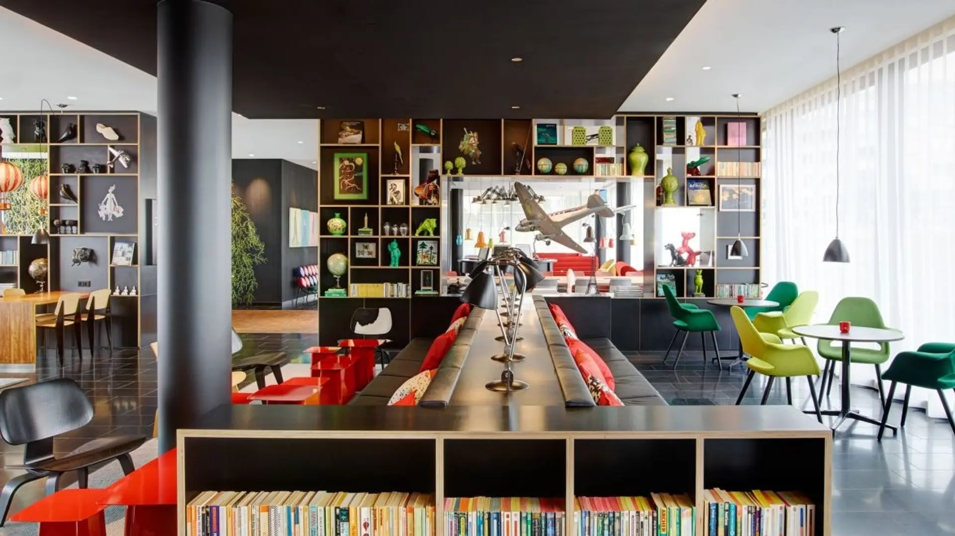 Children room with books, colourful chairs and toys 