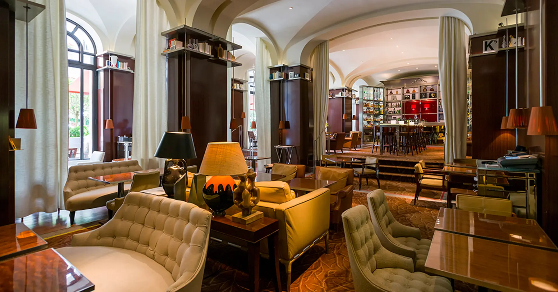 Inside The Bar Long or Le Bar Long in Paris a warm lighted lounge in all colours.