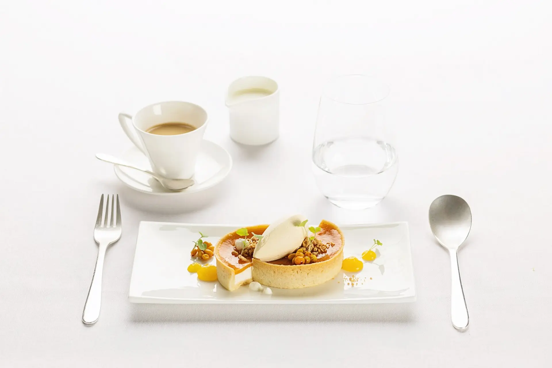 Dessert_in_first_class_tart_with_sea_buckthorn_jelly_and_sour_cream.jpg