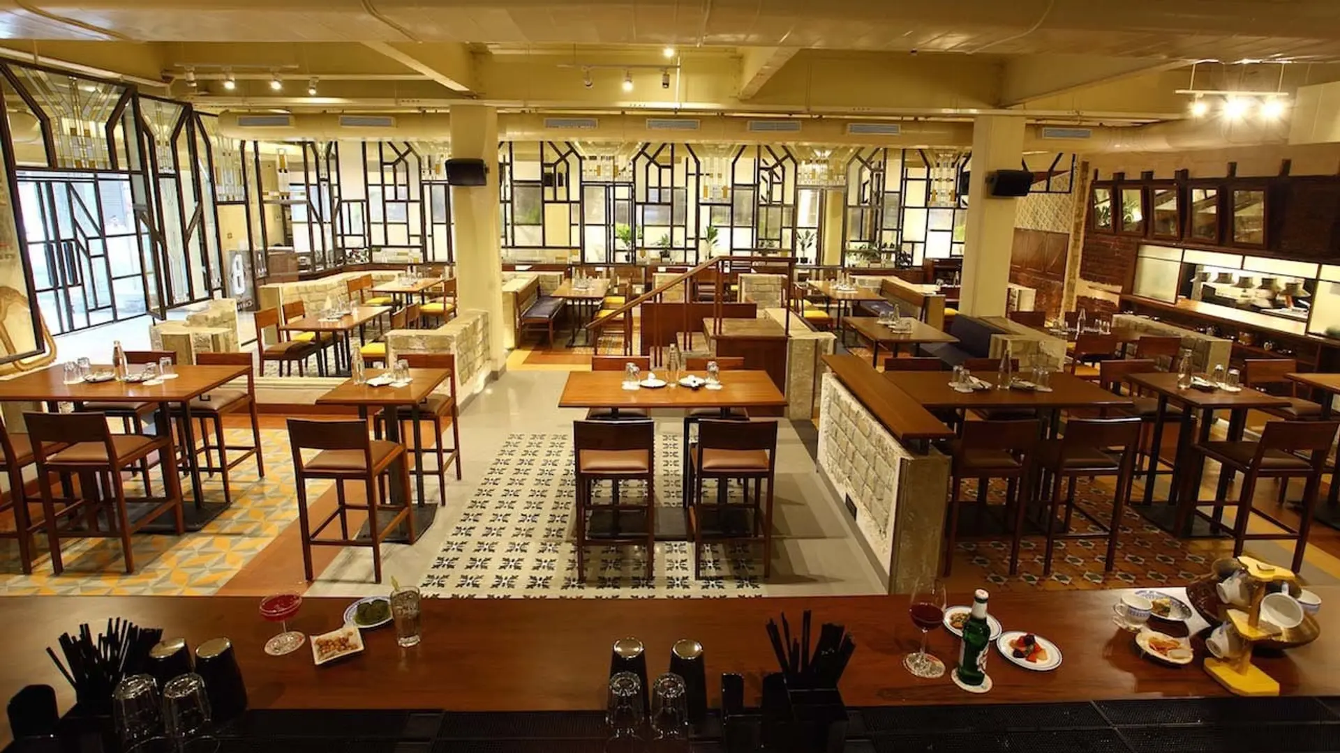 Bombay canteen with wooden furniture and white roof.
