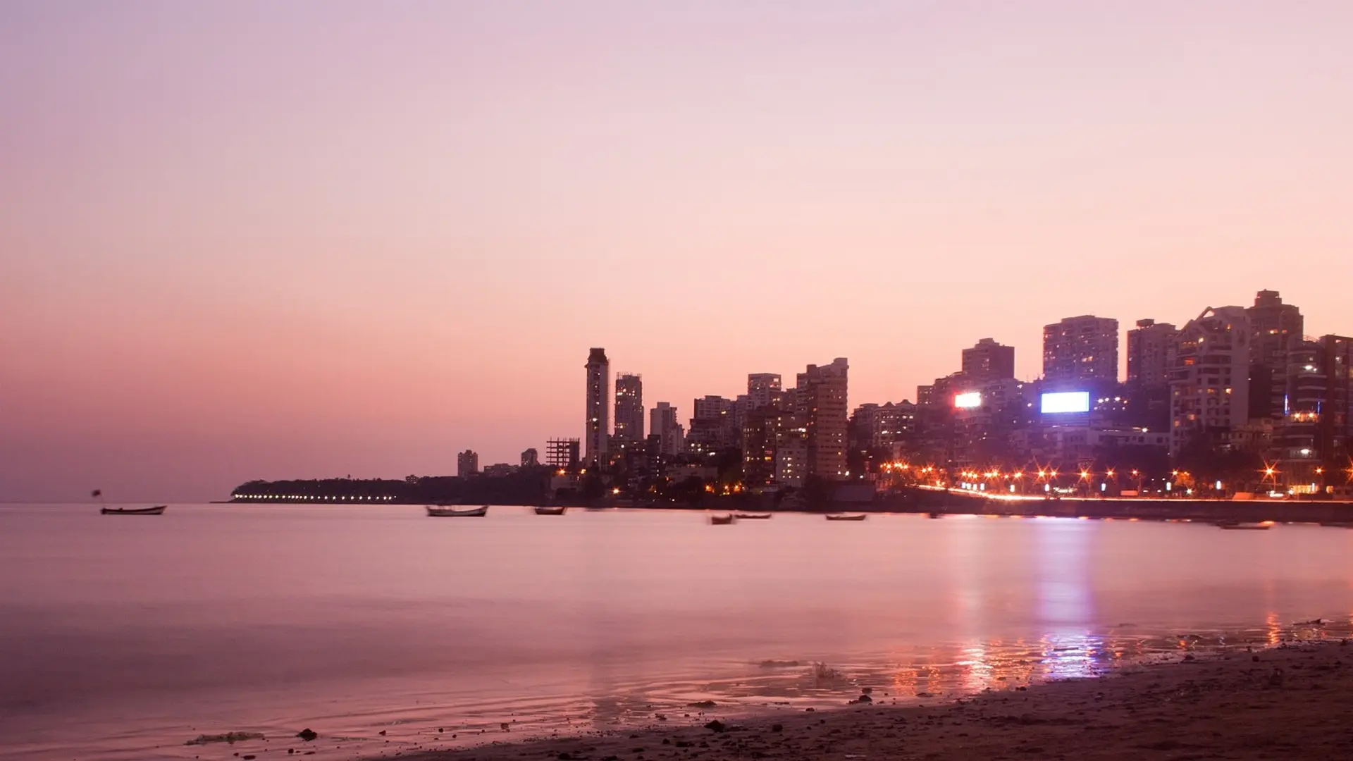 View of sunset, the shore and the city of Mumbai.