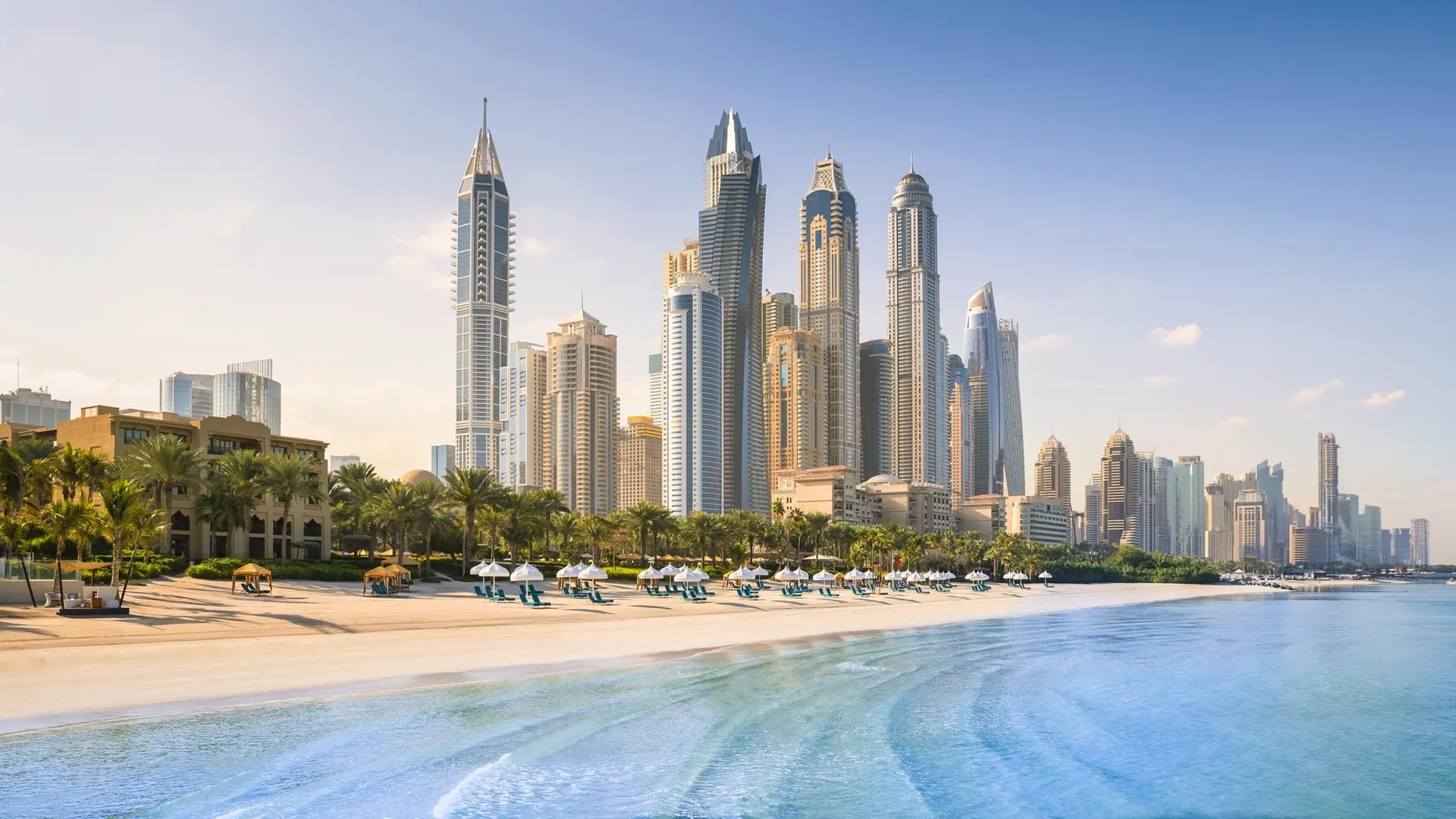 a view from dubai's tall buildings from the beach line