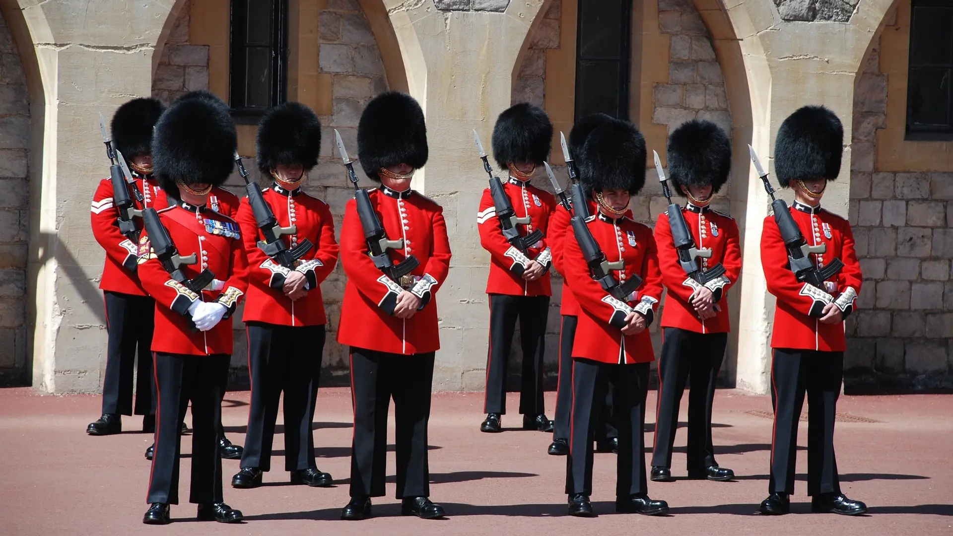 the queen's guard standing in front of Windsor castle