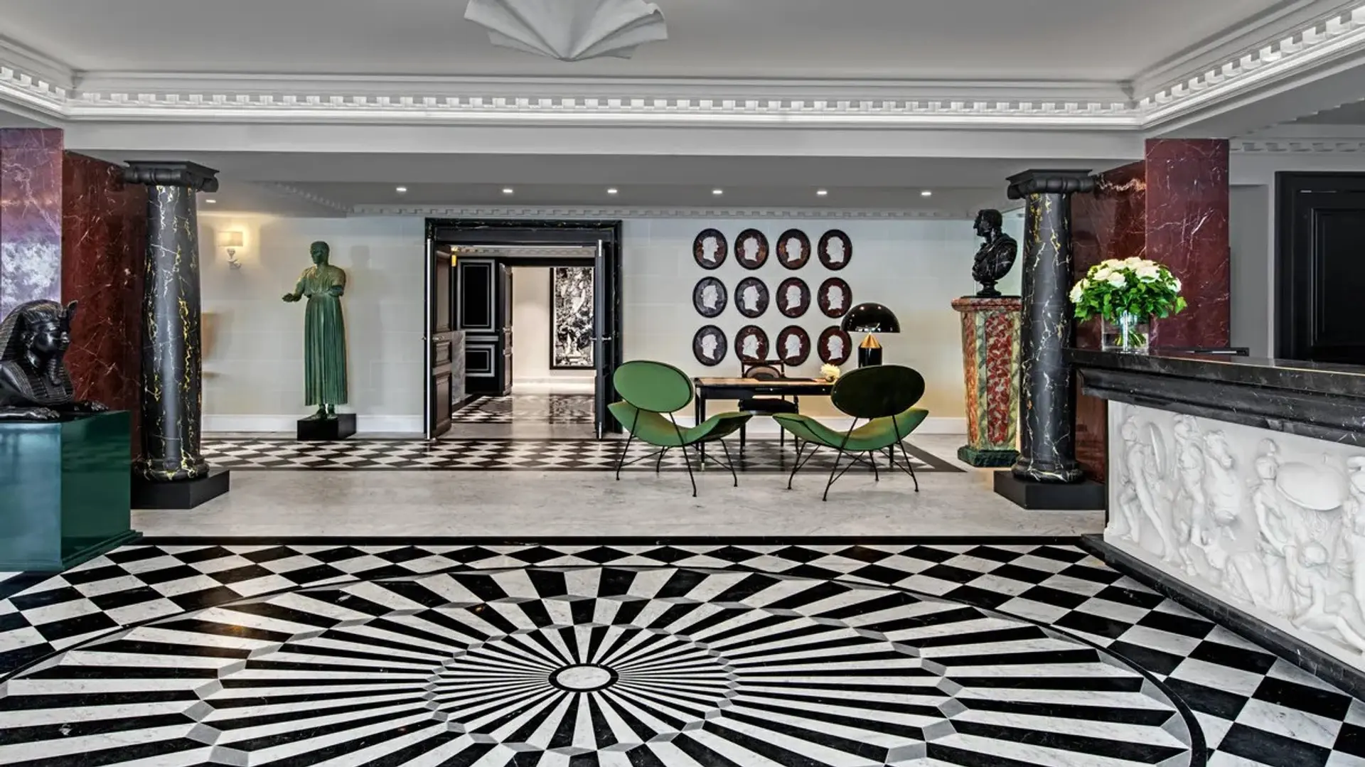 reception at hotel de berri champs-elysees paris with a black and white patterned floor
