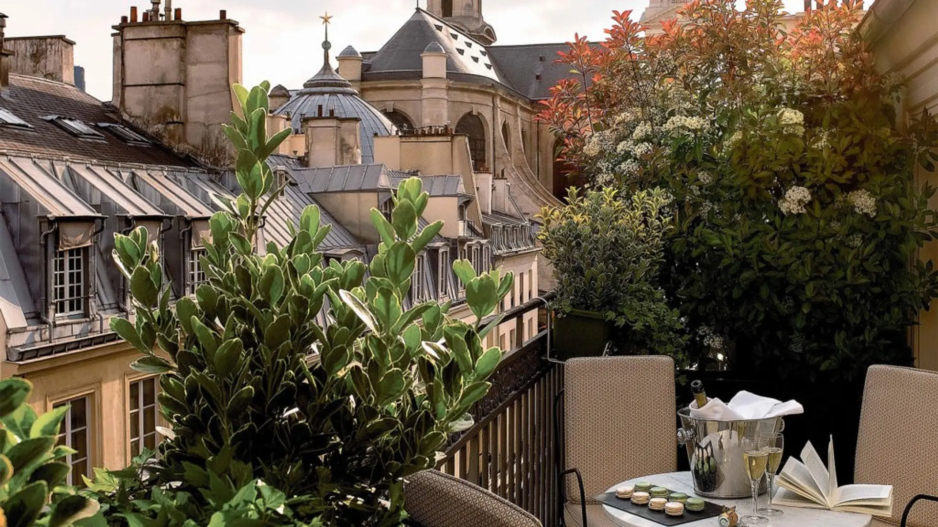 terrace at esprit saint germain hotel with champagne glasses