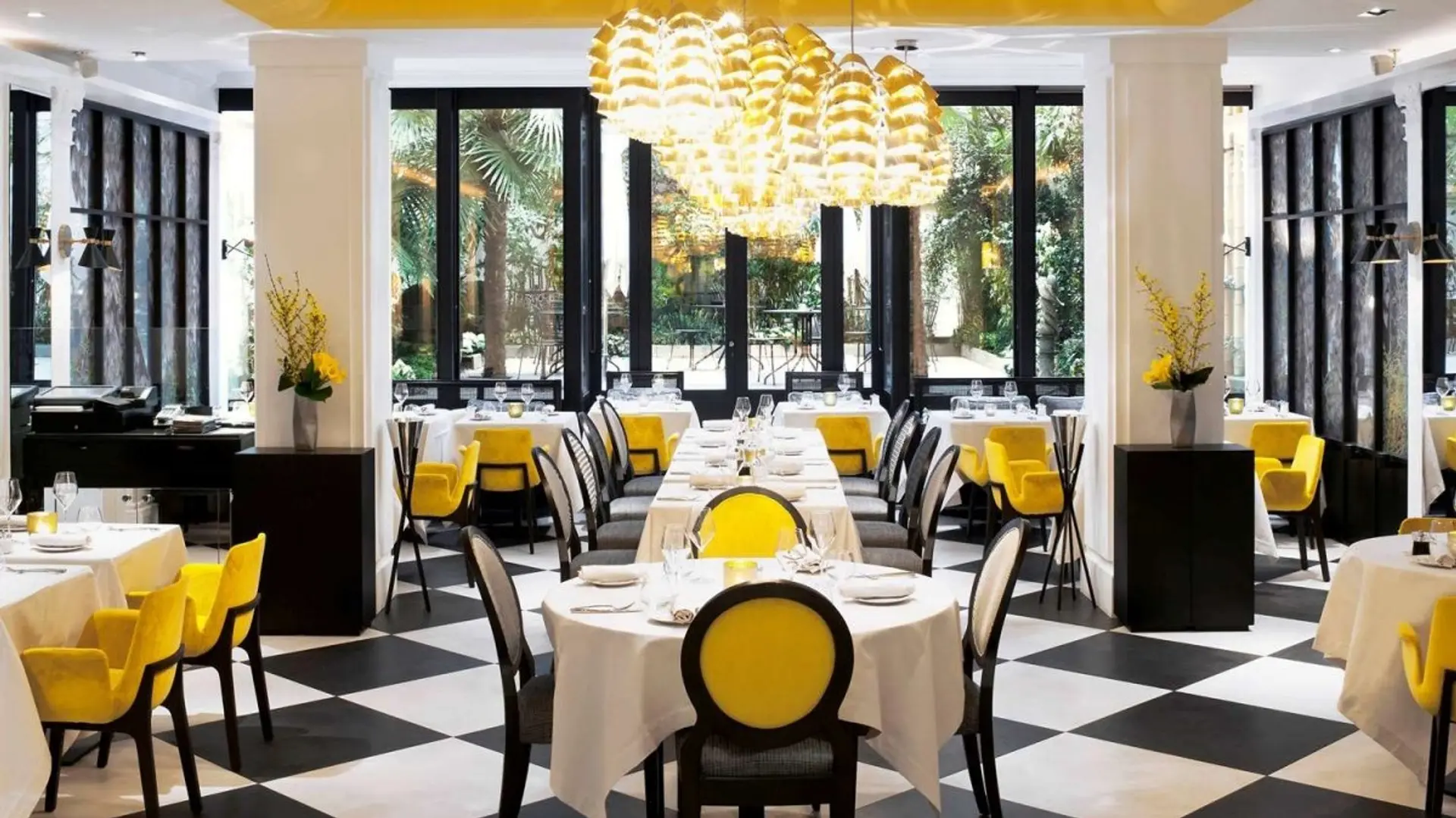 Resturant with yellow and black chairs at sofitel paris le faubourg