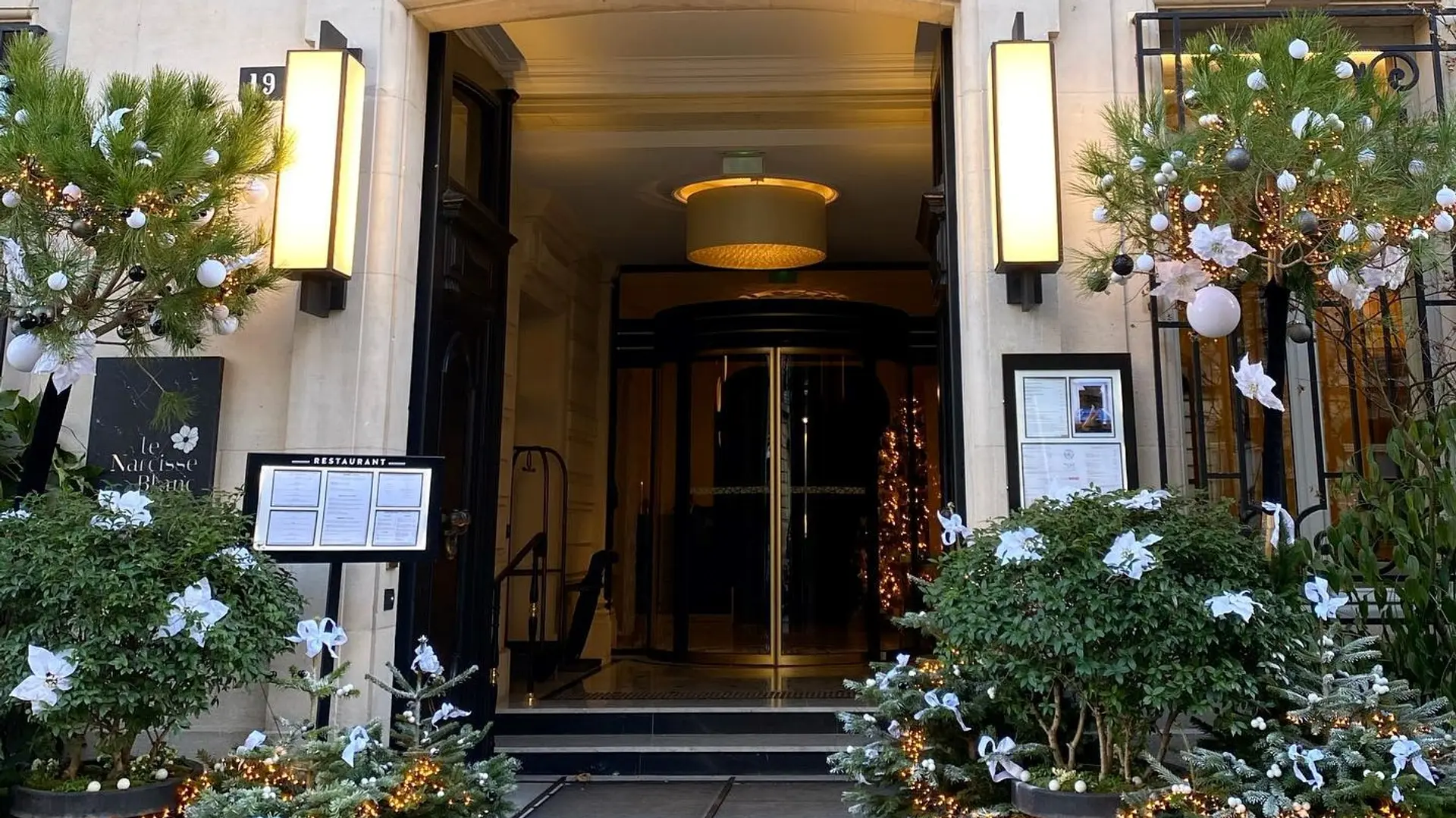 main entrance of le narcisse blanc hotel & spa paris
