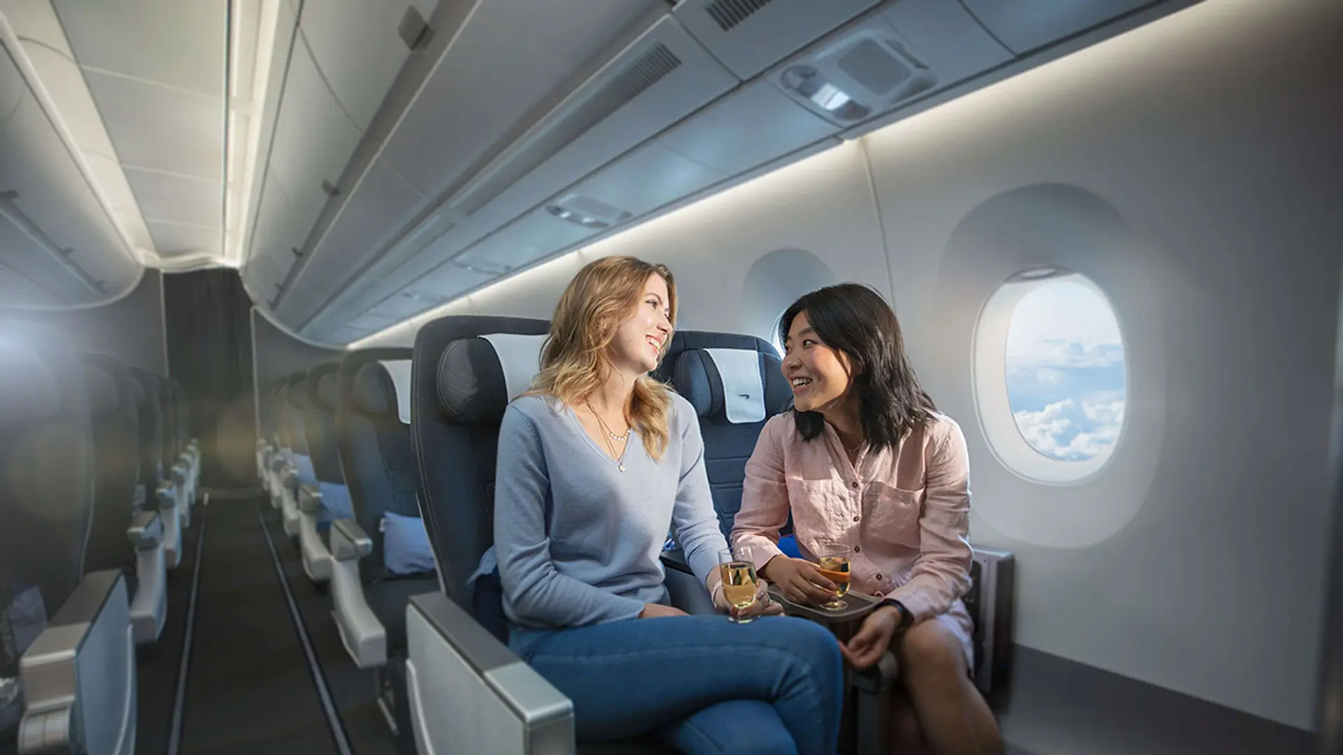 two women chatting in British Airways World Traveller Plus, Premium Economy
