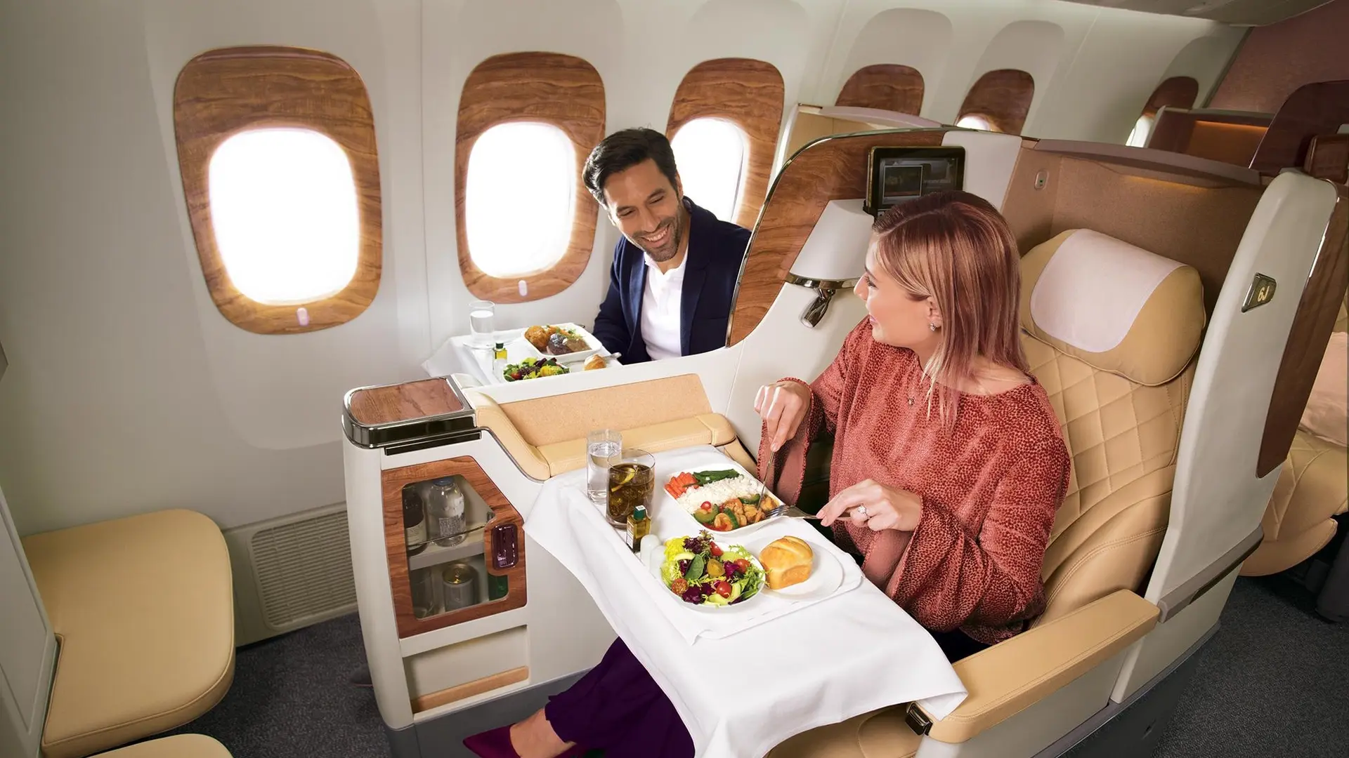 Smiling couple enjoying a dinner at businessclass.