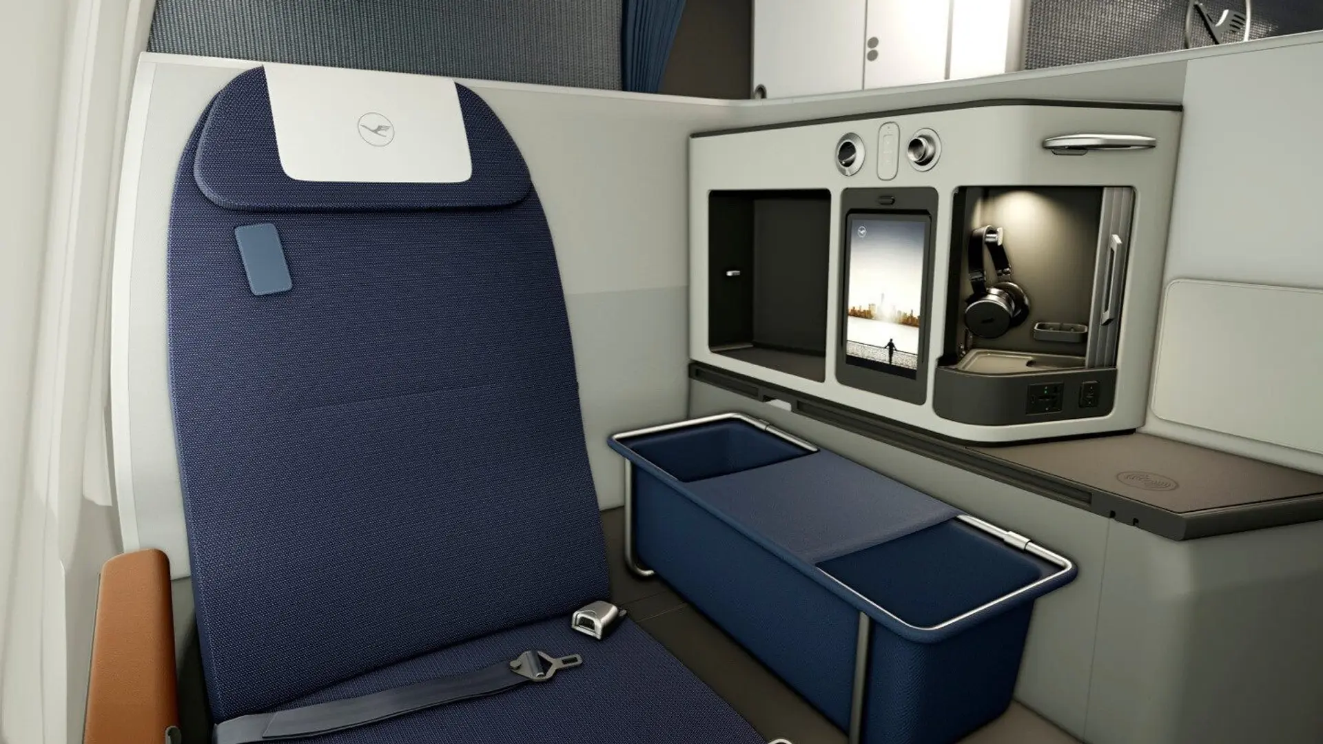 A blue lufthansa seat with a smart screen and headphones on the left hand side.