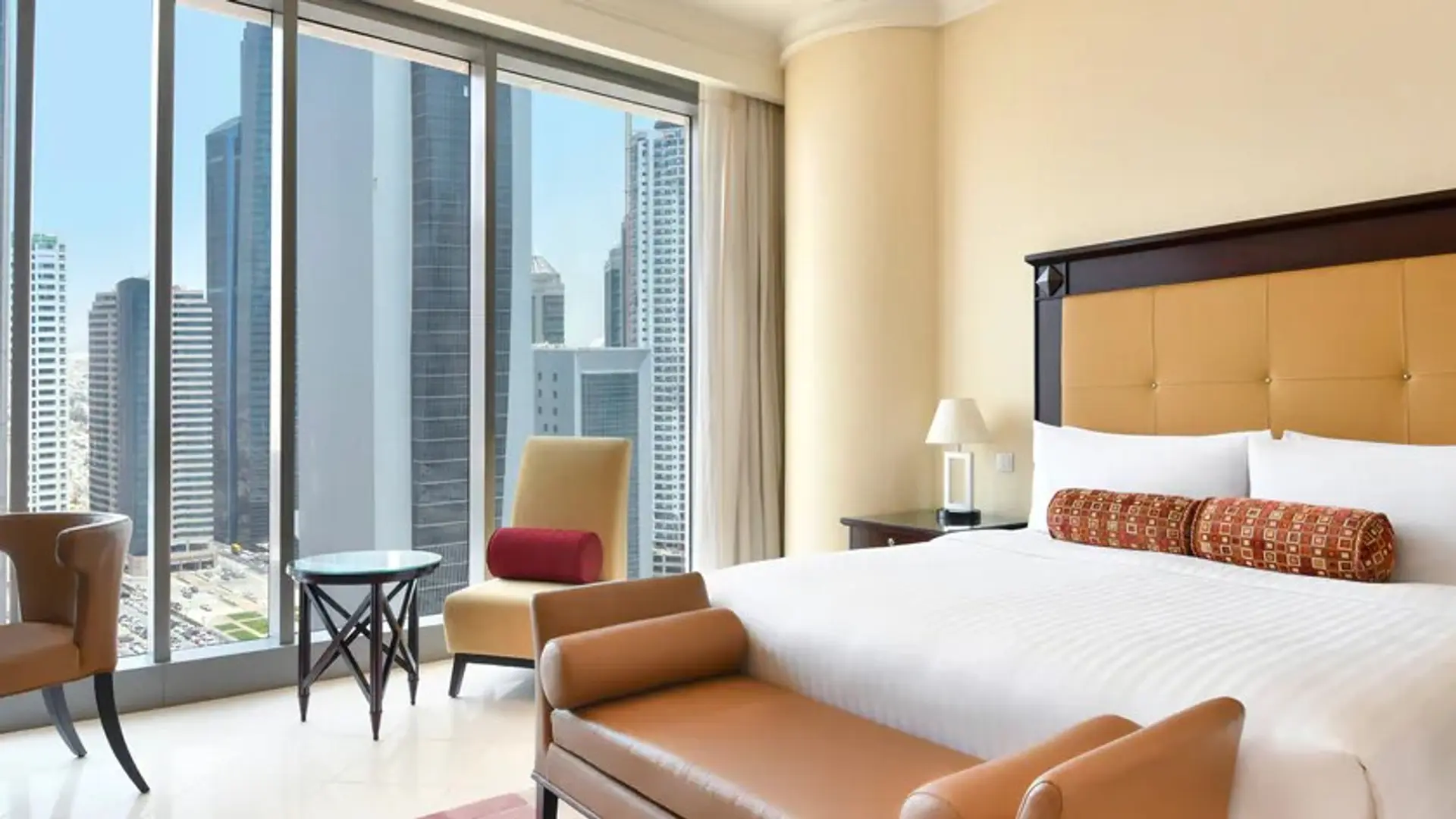a room with large windows at JW Marriott Marquis City Center Doha