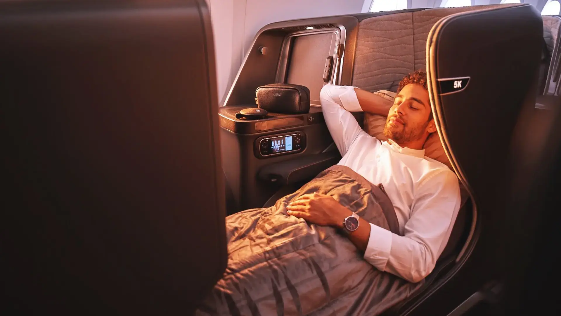 a man sleeping in his Turkish Airlines 787 9 Dreamliner