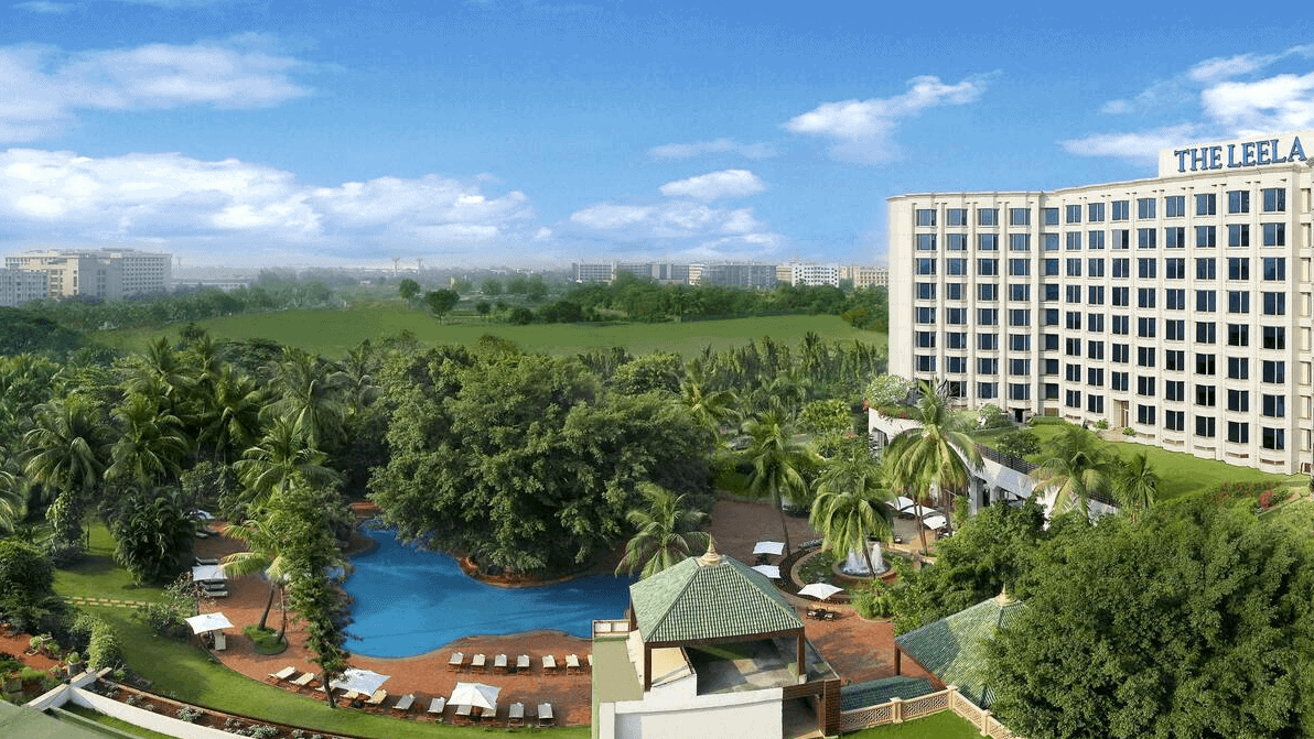 Bird perspective of The Leela, Mumbai at daytime with view of the hotel and pool area