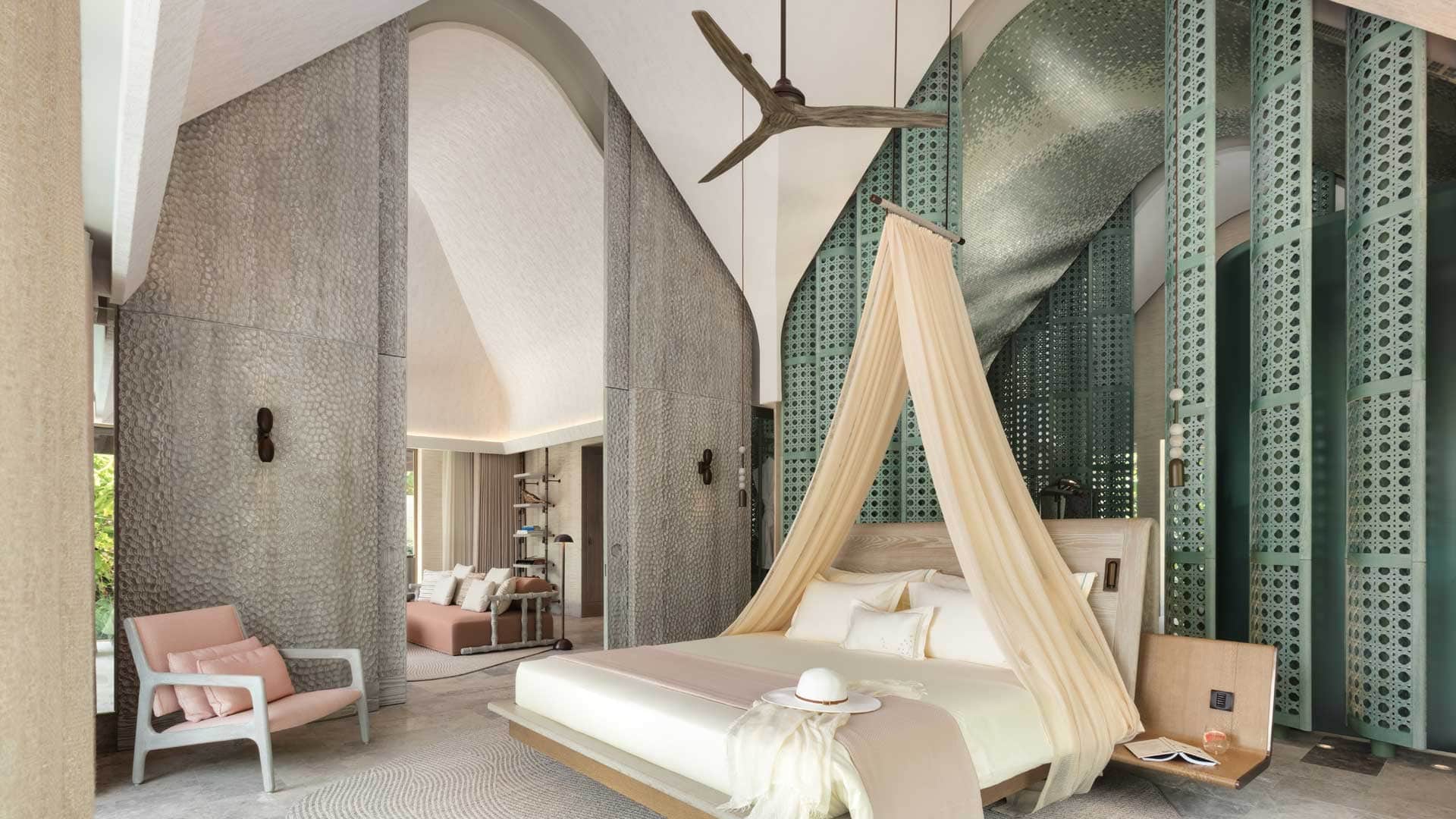 Suite with white and grey decor at JOALI BEING.