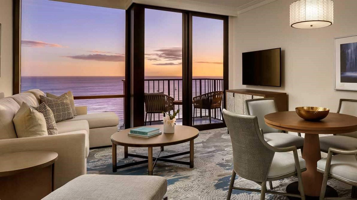 Living room and view to the water at Halepuni Waikiki by Halekulani.