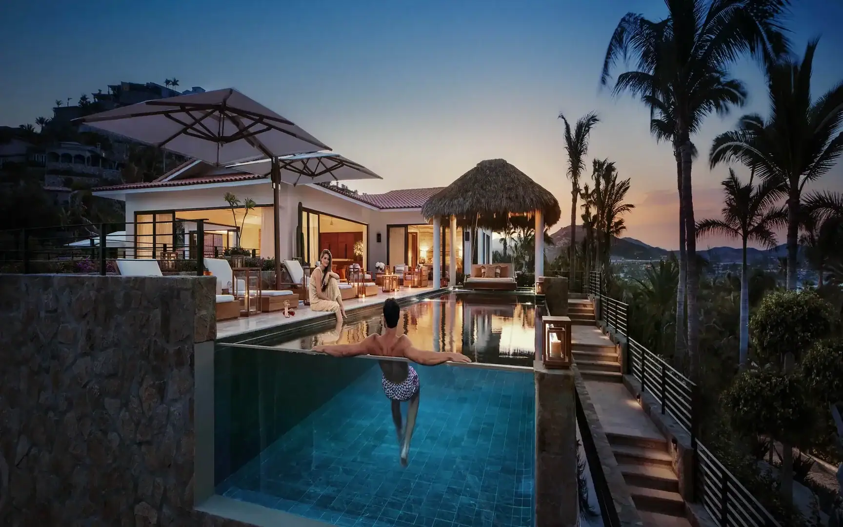 a couple relaxing in the swimming pool of their room at One&Only Palmilla