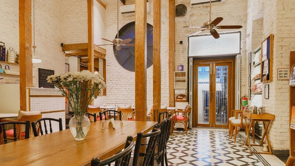 Dining area at Abode Botique Hotel Bombay with wooden interior