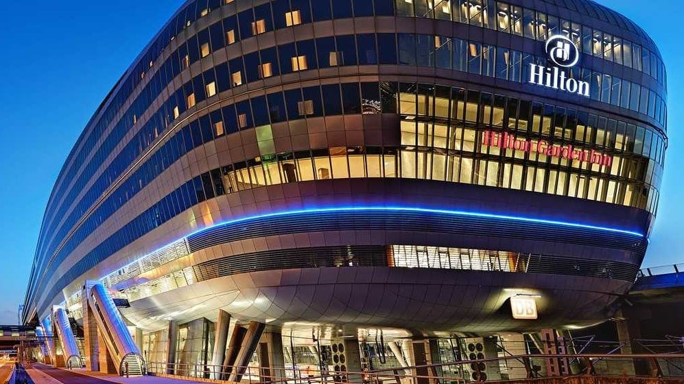 Large and Long building with text saying HILTON in white text