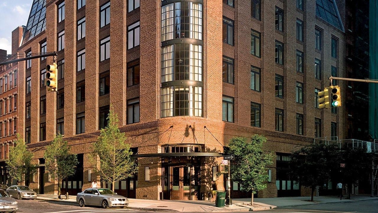 main entrance of The Greenwich Hotel new york with a brick design