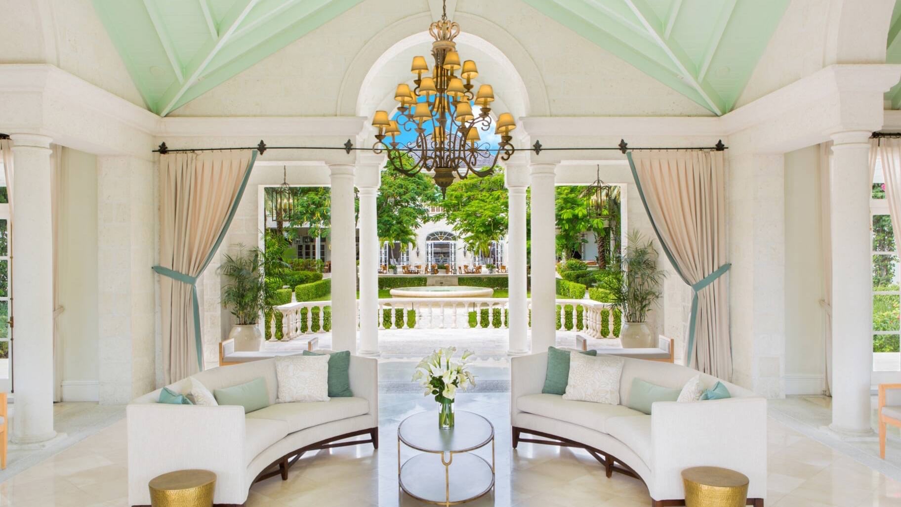 a lounge at the The Palms Turks & Caicos with a garden behind
