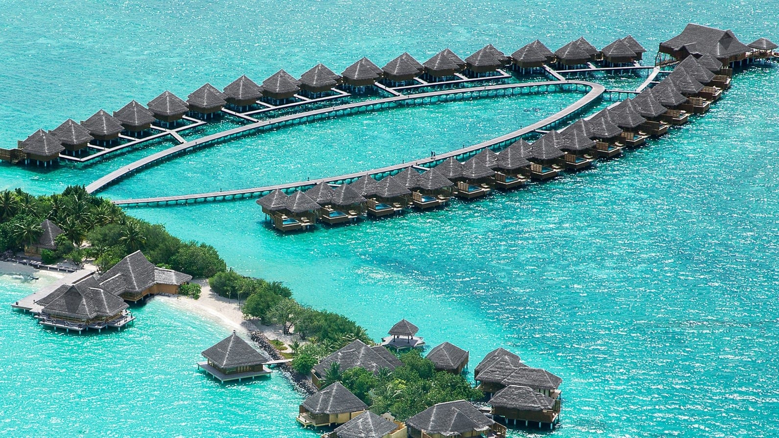 View of island and on water suites at Taj Excotica Resort å Spa, Maldives.