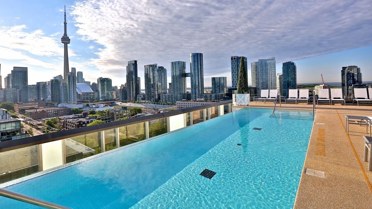 Outdoor swimming pool area at The 1 hotel toronto with view looking out over the city.
