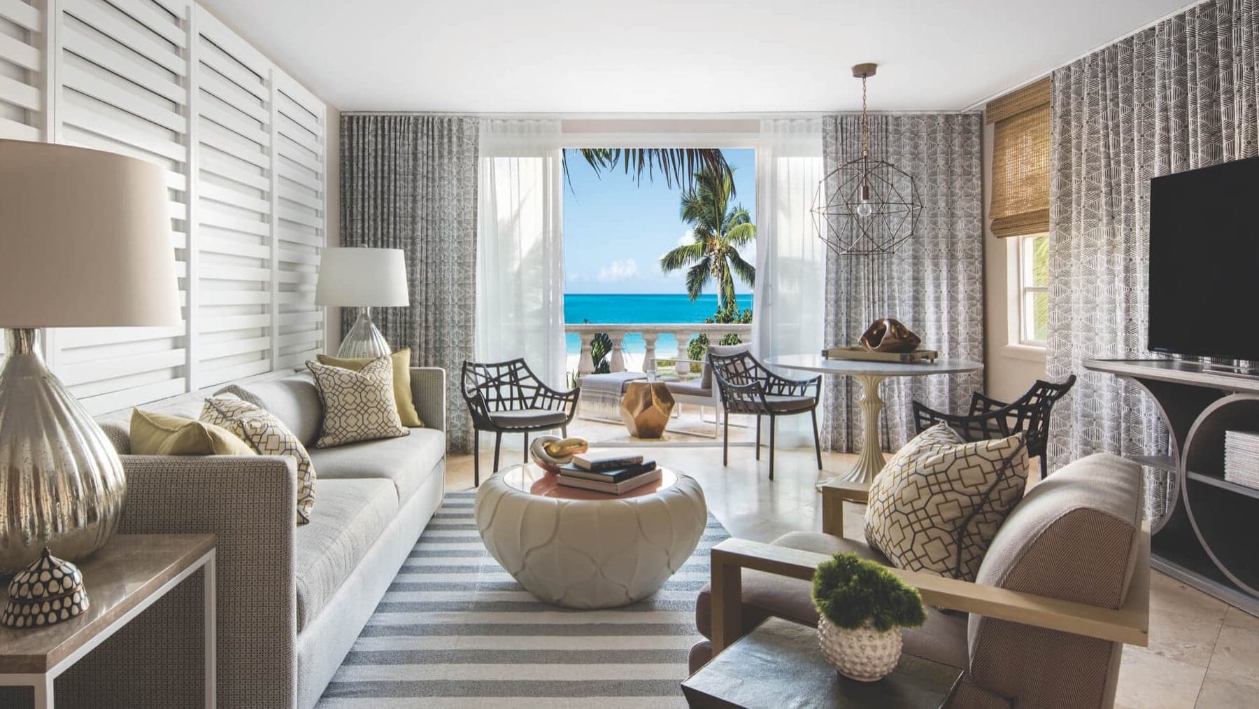 an elegant room at The Grace Bay Club with a private baldony