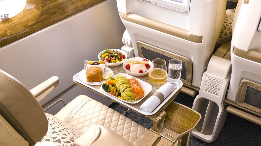 Spagetti, salmon, salad, bread and dessert at premium economy at Emirates