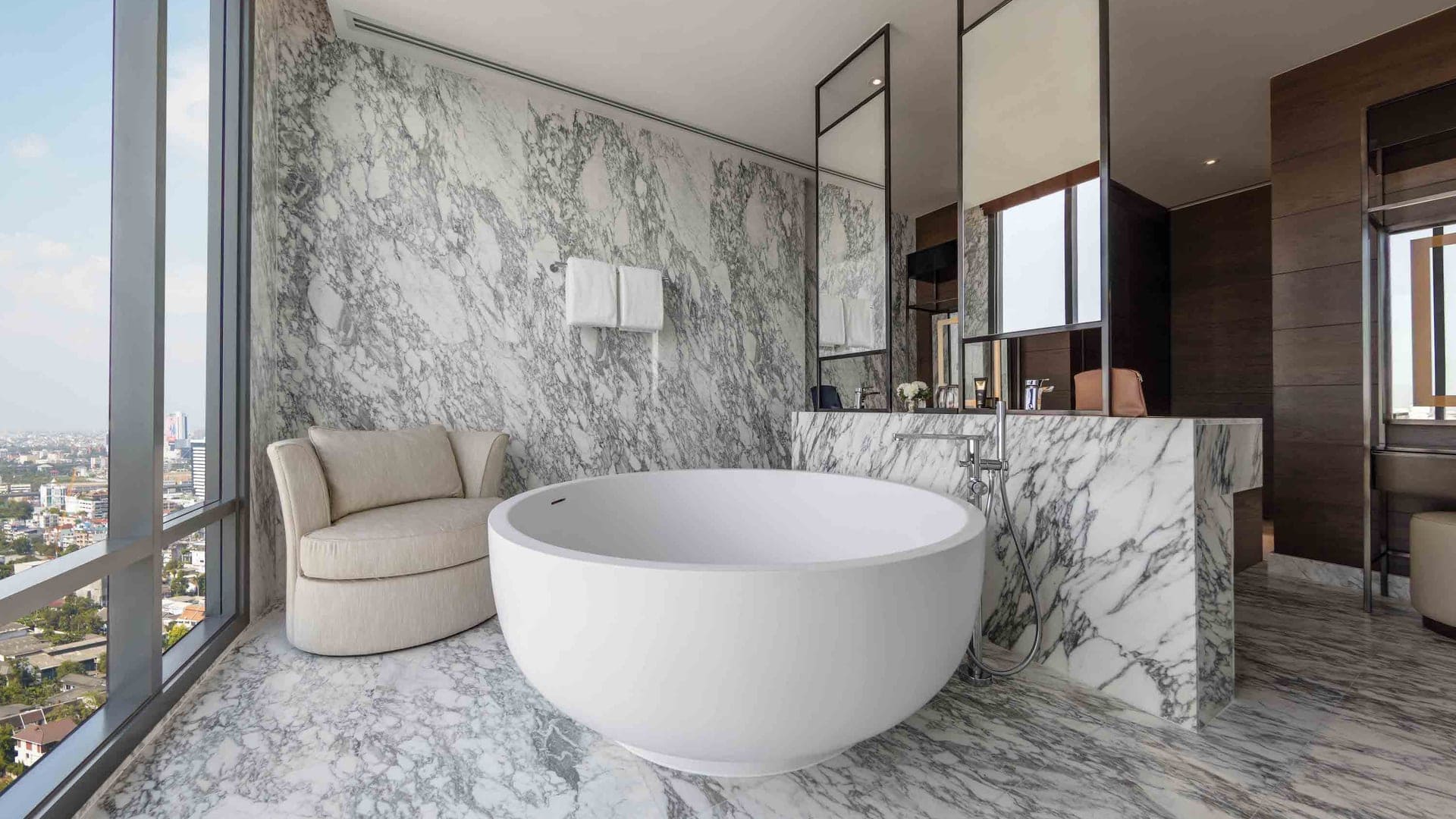 Bathroom in white marble at 137 PILLARS SUITES + RESIDENCES bangkok