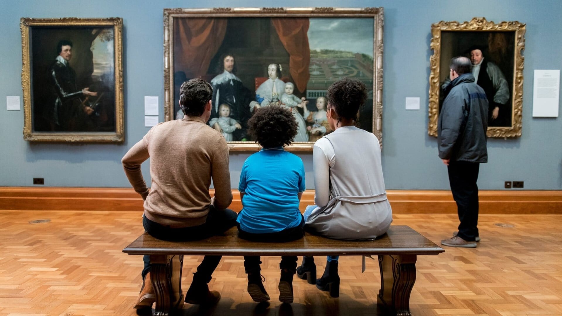 people sitting looking at the paintings at National Portrait Gallery