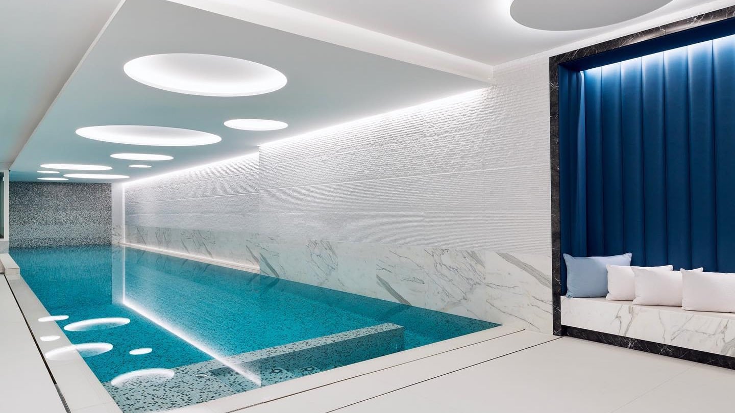 Inside pool area with marble walls at The Woodward