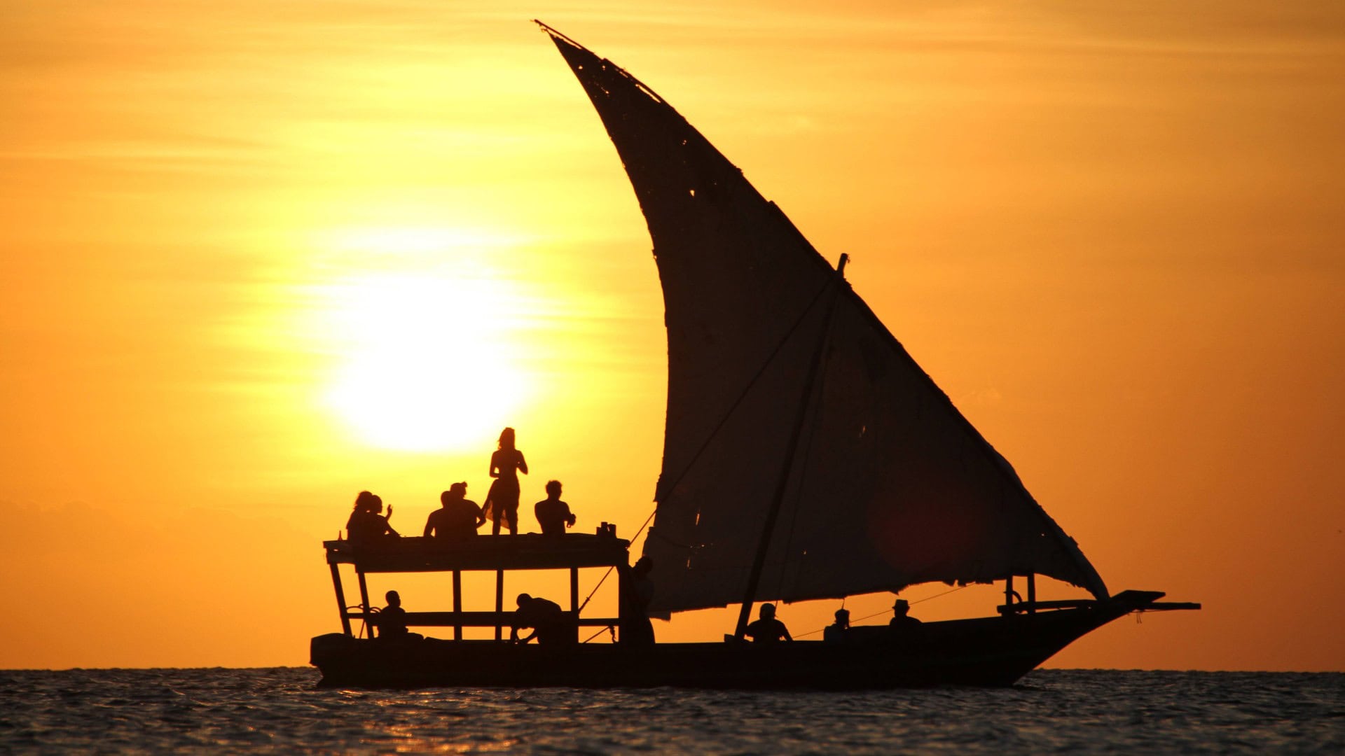 Sail boat cruising in sunset in muscat