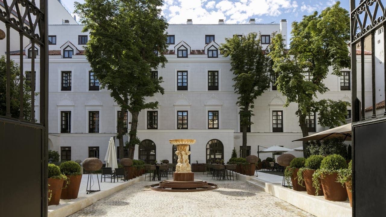 Gate entrance to Palacio De Los Duques Gran Meliá with the fountain garden