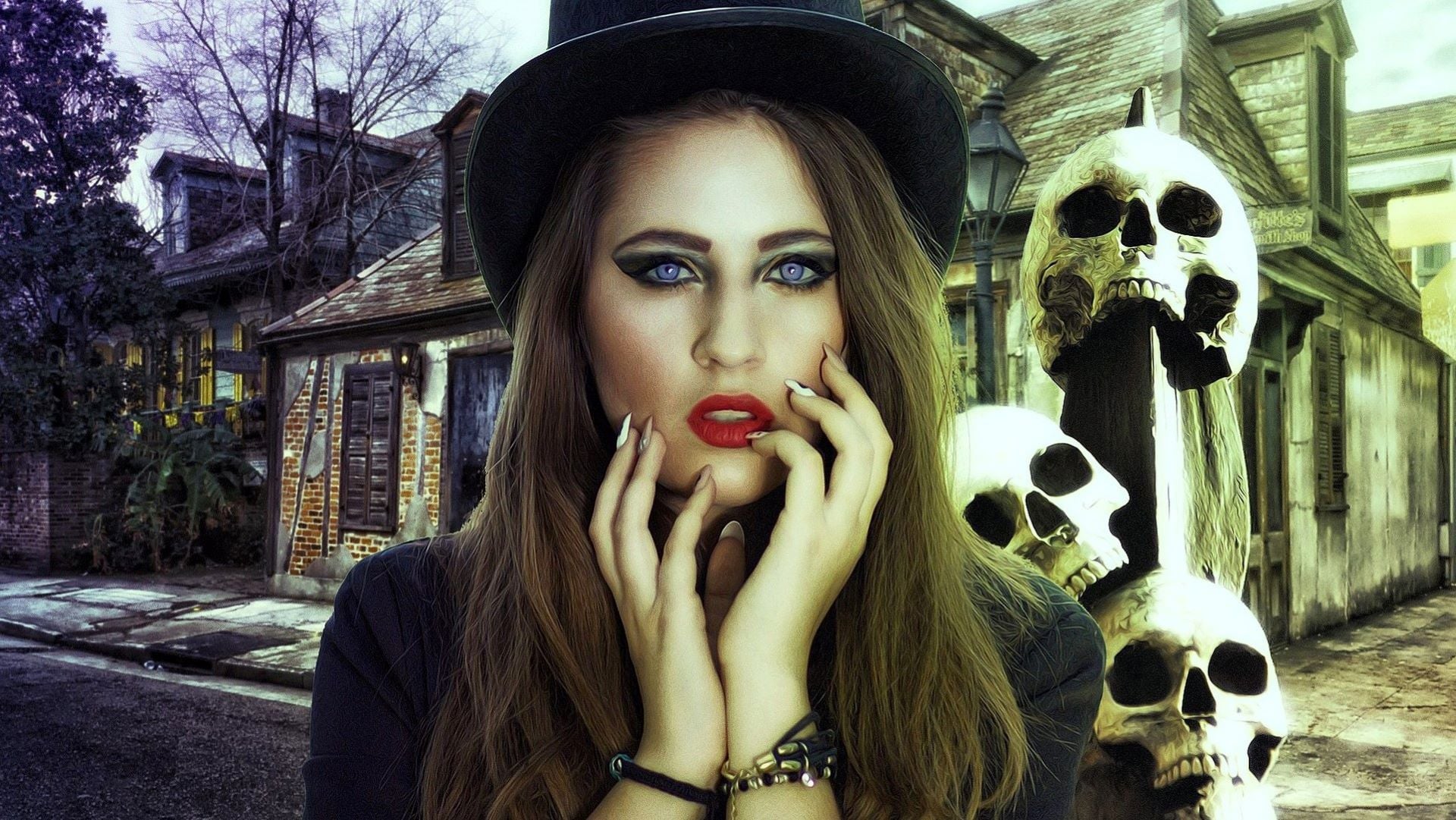 Woman with black hat, red lipstick, blue water coloured eyes, and a black outfit standing in front of three skulls and a broken house in New Orleans.