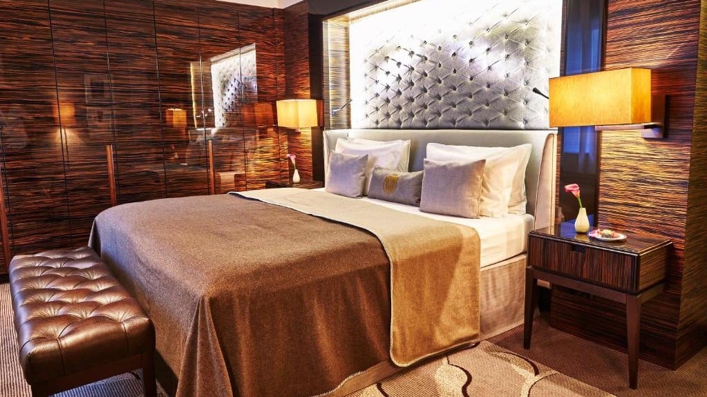 a bed in a Steigenberger Frankfurter Hof room