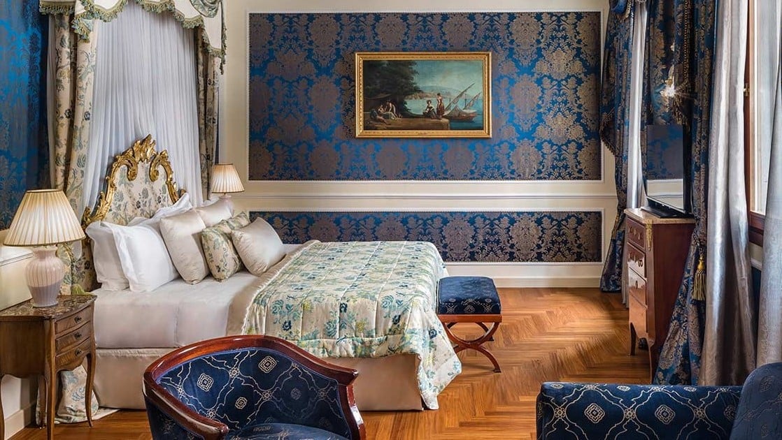 Bedroom at Baglioni Hotel Luna with blue interior