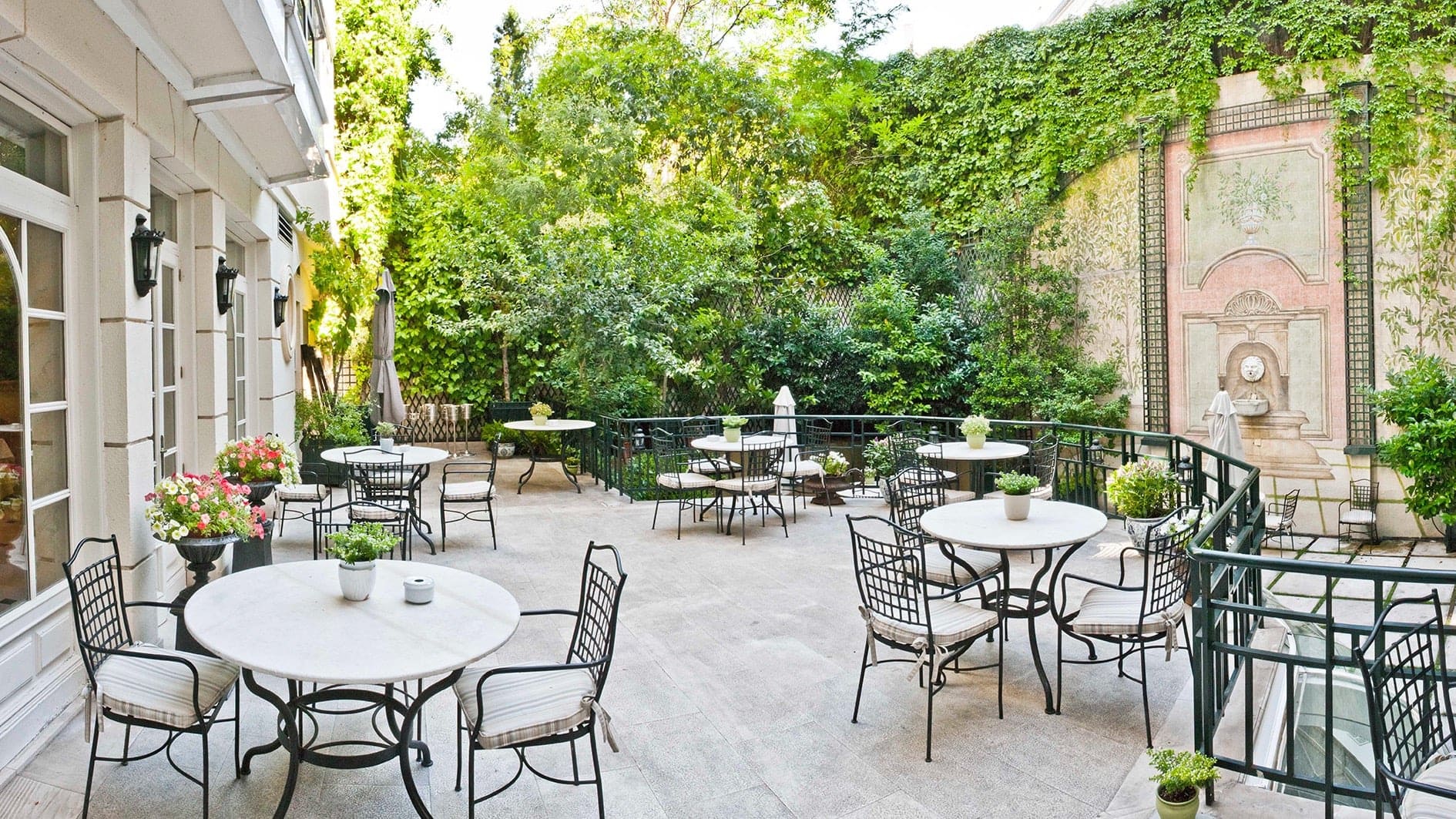 Outside hangout space surrounded by beautiful nature at Relais & Châteaux Hotel Orfila in Madrid