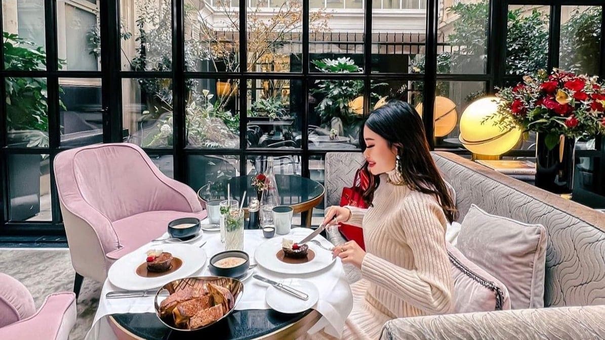Woman eating desert at le narcisse blanc hotel & spa