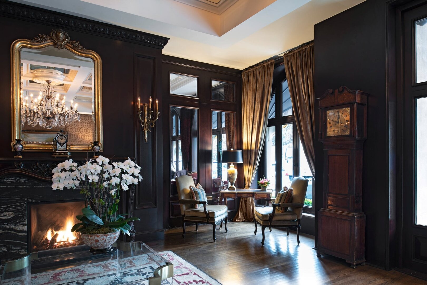 Room with a fireplace and black decor at the wedgewood hotel & spa