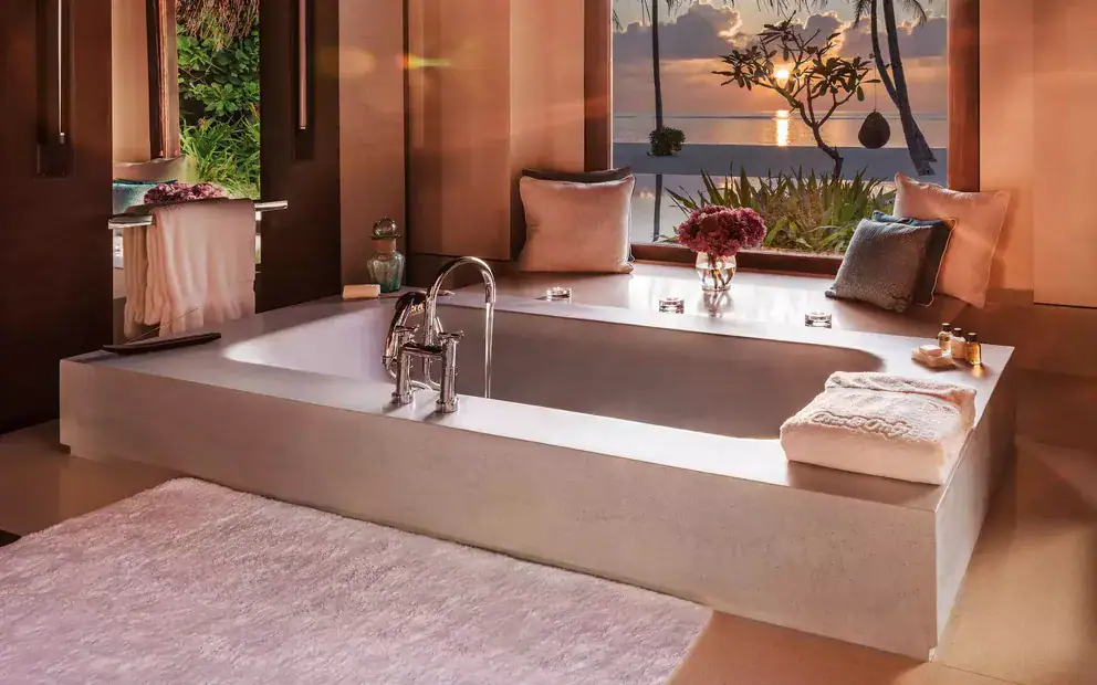 a bath tub of a room at One&Only Reethi Rah