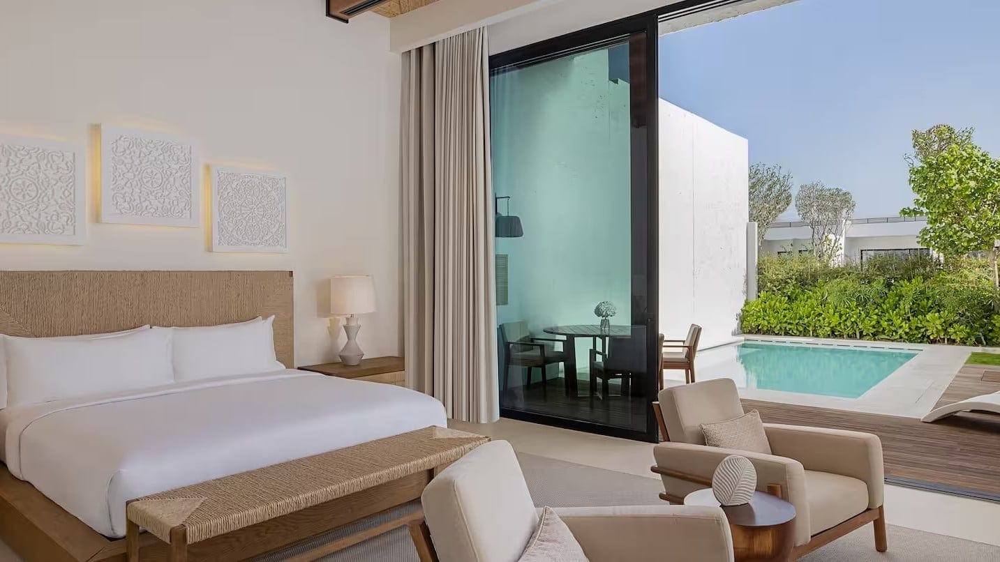 a room with an attached swimming pool at Maysan Doha