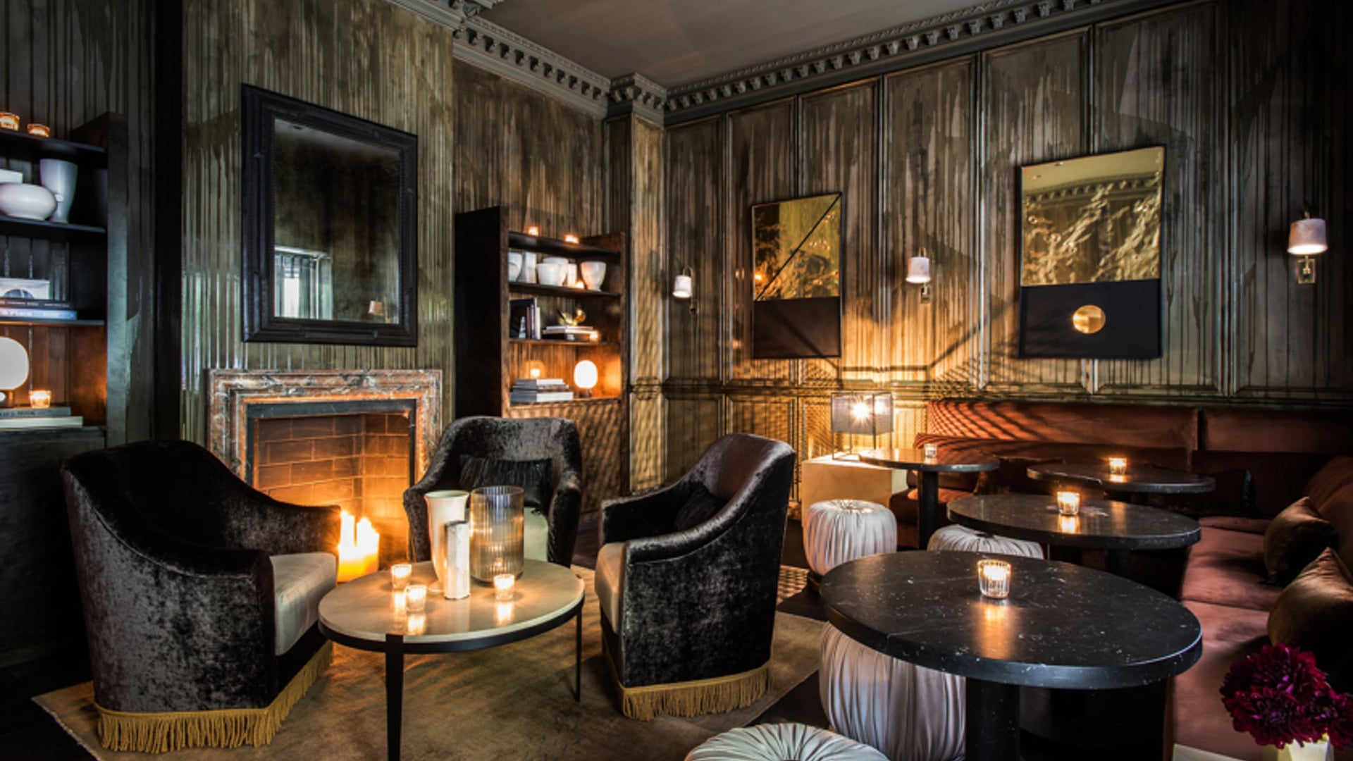 Bar at The Talbott with dark interior and a fireplace