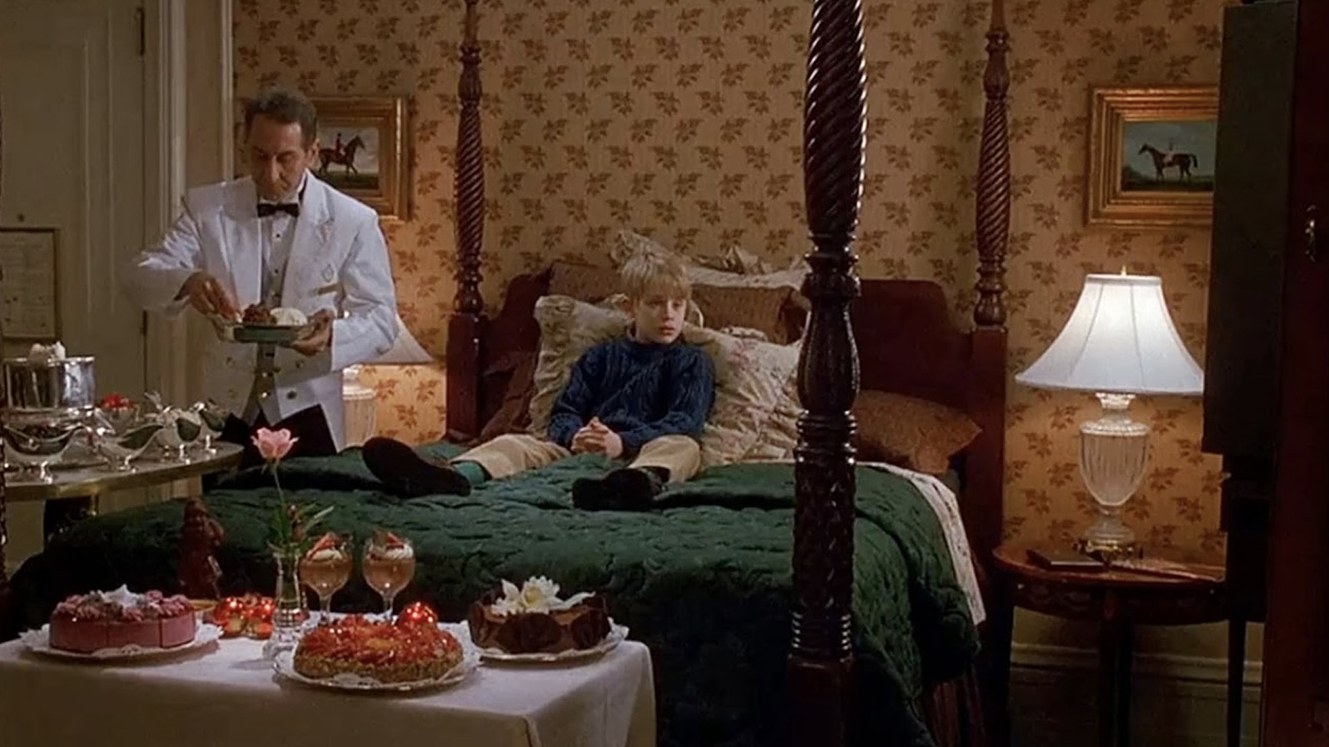 Macaulay Culkin sitting on the bedroom at The Plaza, A Fairmont Managed Hotel in New York