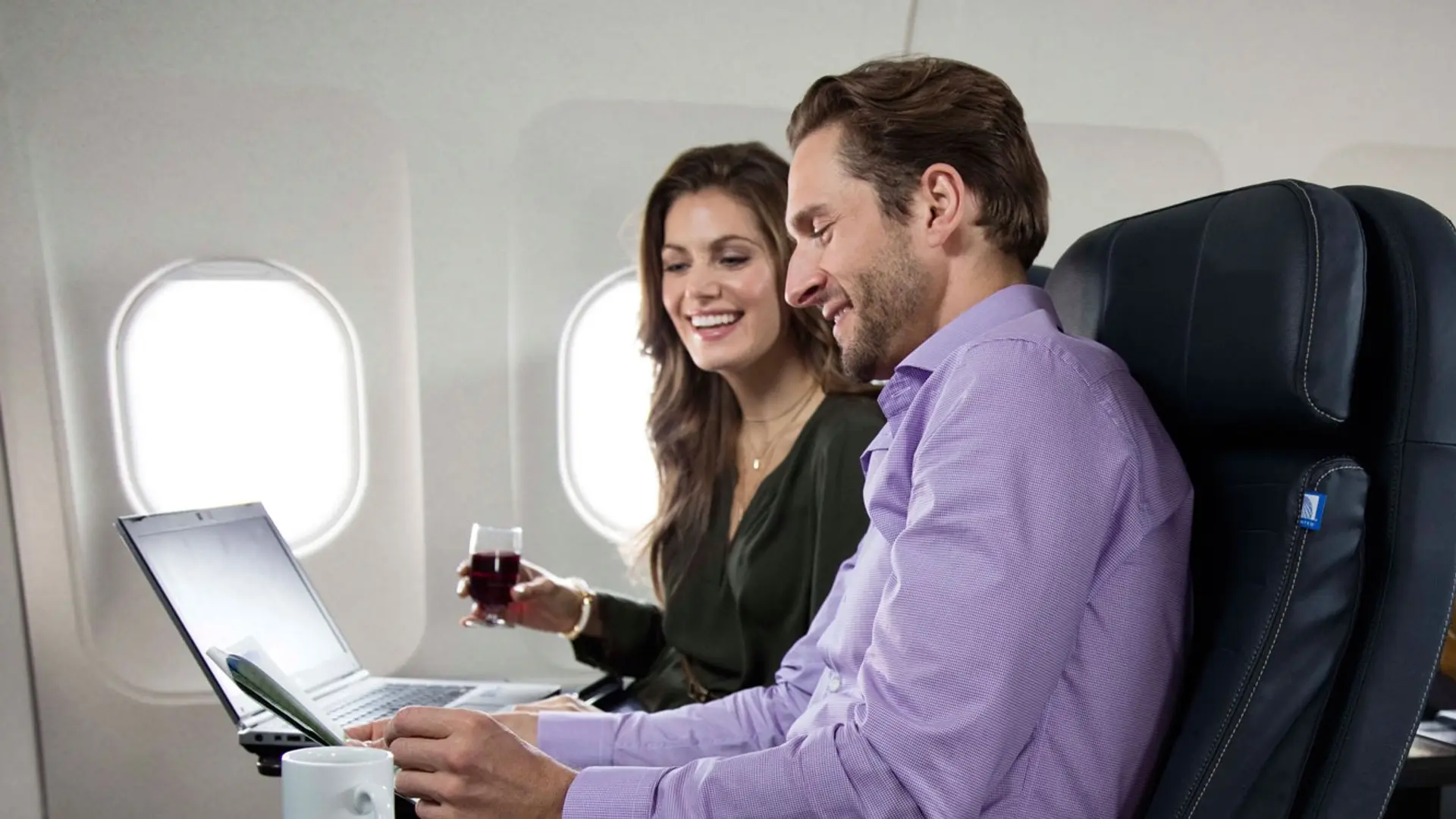 A man and a woman enjoying a flight