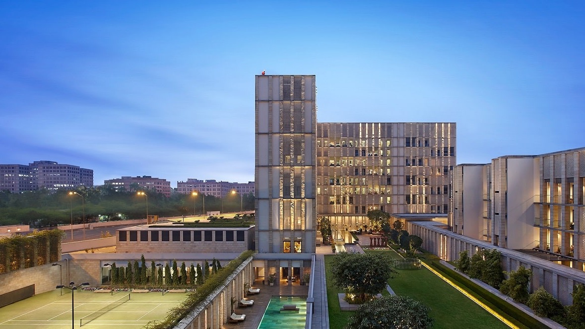 Outside view of The Lodhi with tennis court, pool and rooftop