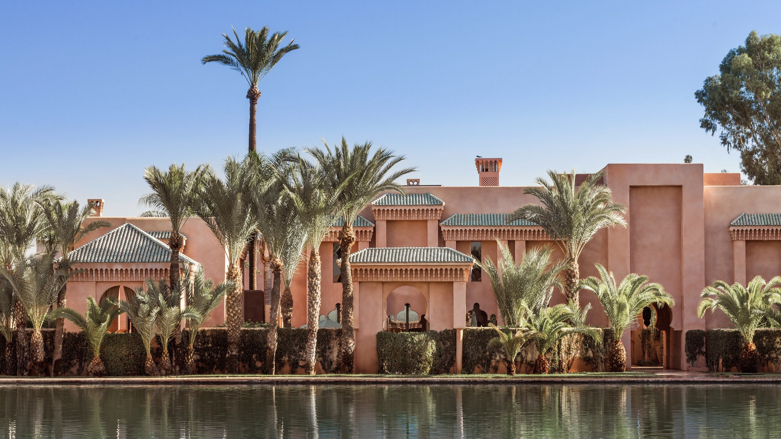 The Amanjena Hotel in Marrakesh from a water perspective durning day time
