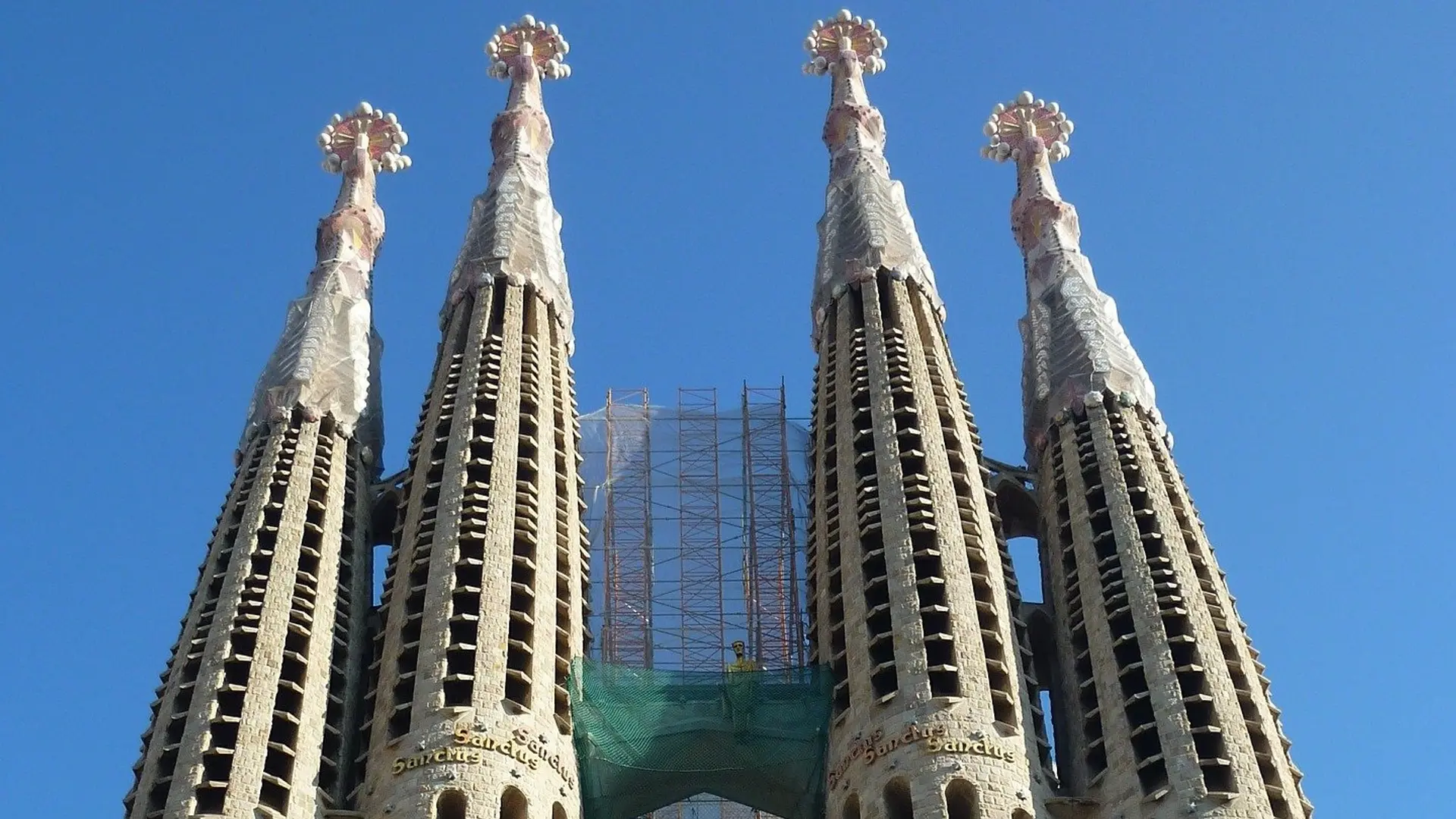 Four spires that scrape the skies in Barcelona.