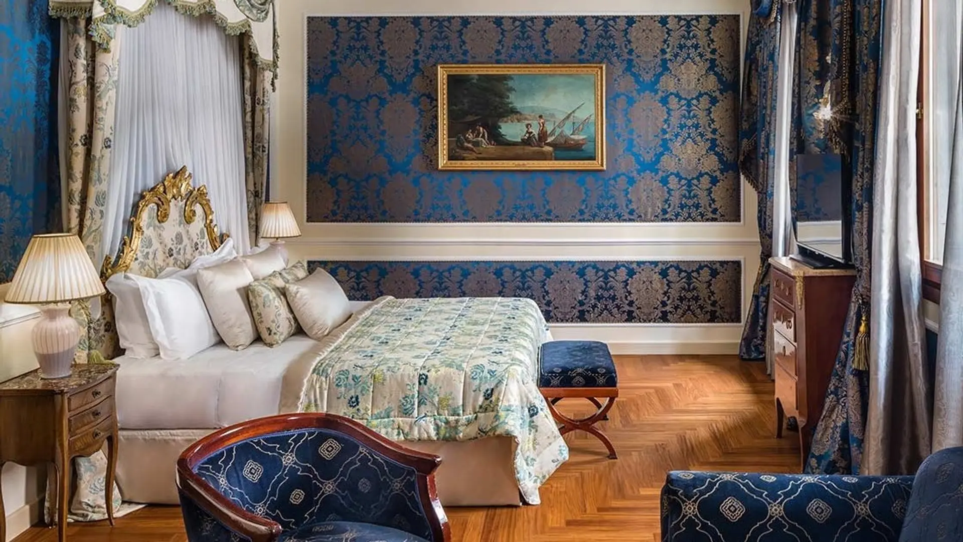 Bedroom at Baglioni Hotel Luna with blue interior