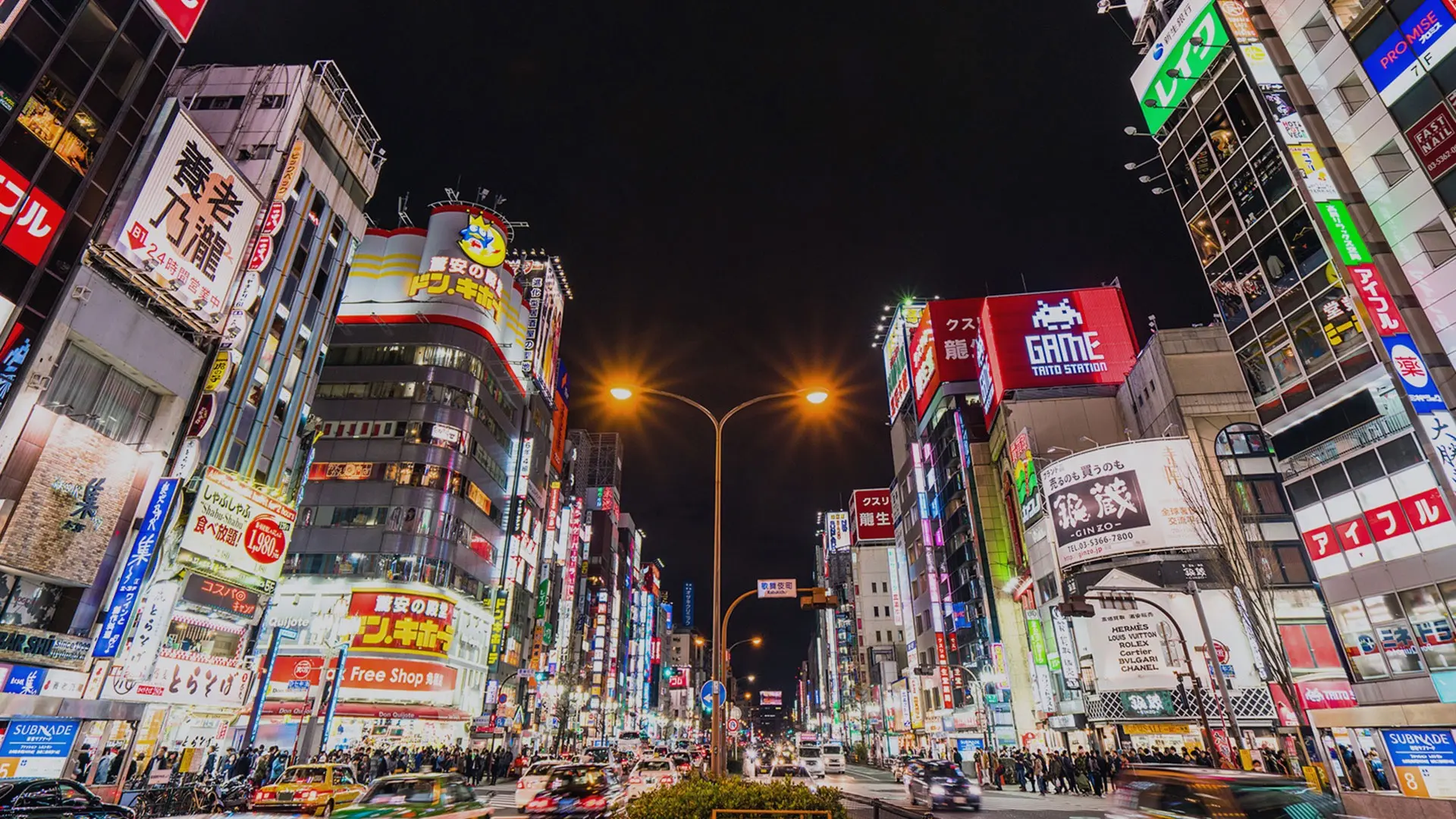City lights, busy street, and advertisements at Shinjuku.